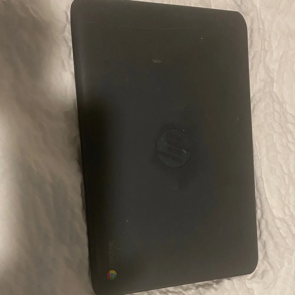 HP Black Laptop with Blue Screen Display